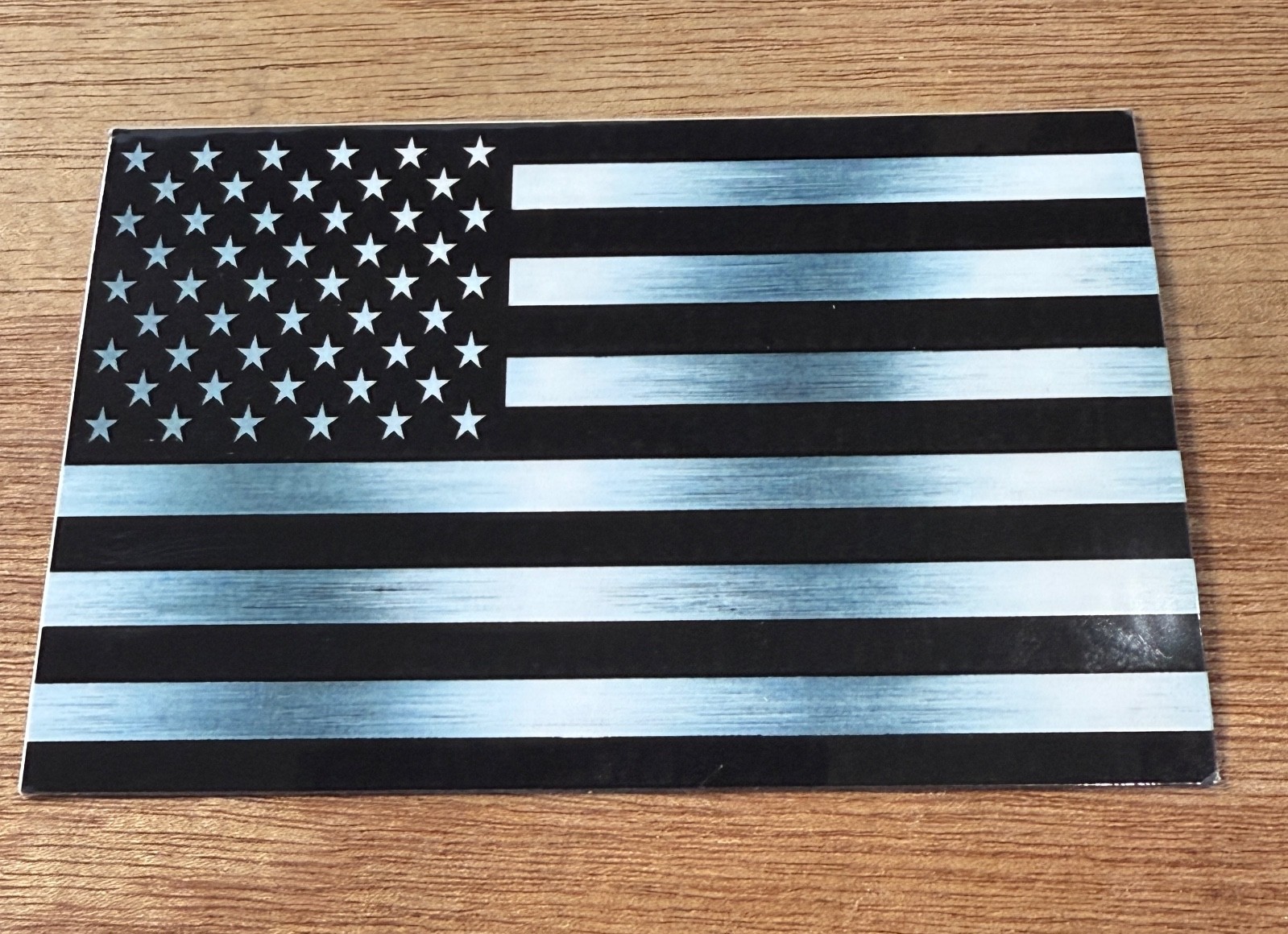 Sticker metallic silver color vinyl laminated American flag subdued Made in USA
