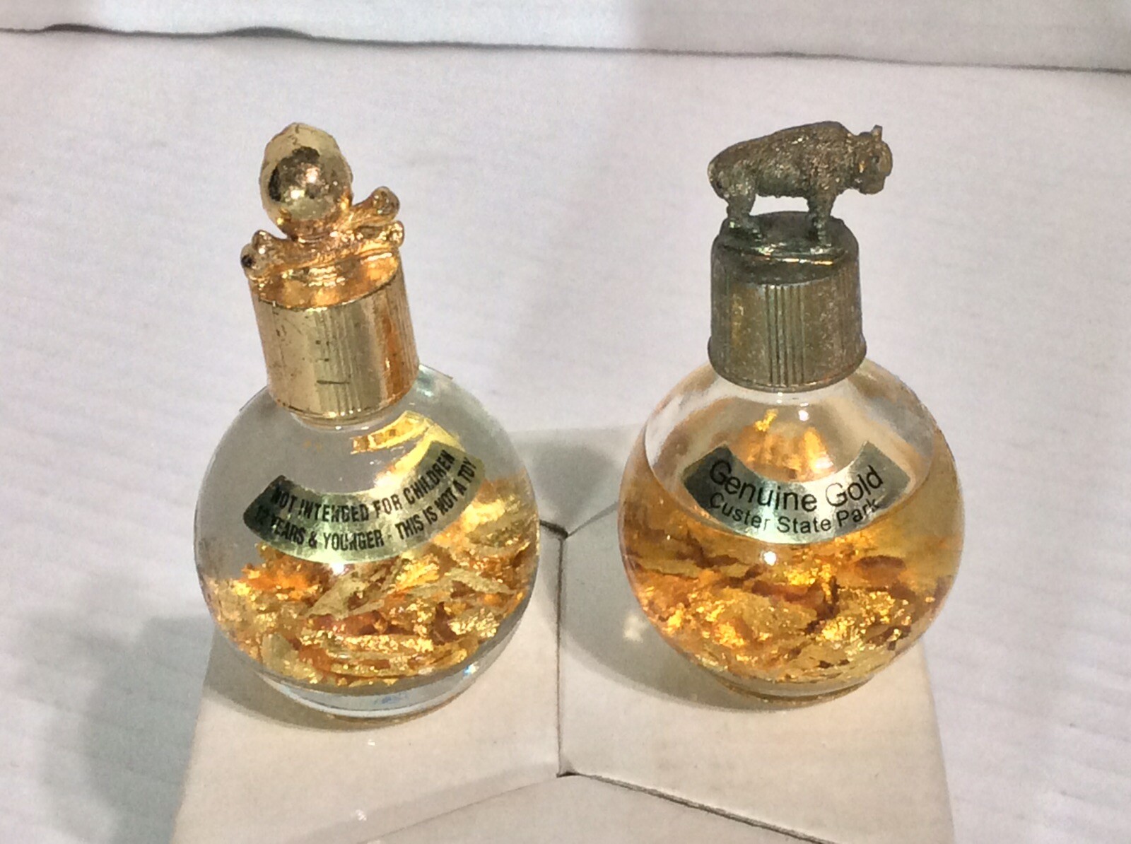 2 Genuine 1 Oz. Miner’s Assay Bottle Gold Flakes Pirate’s Booty Skull & Buffalo