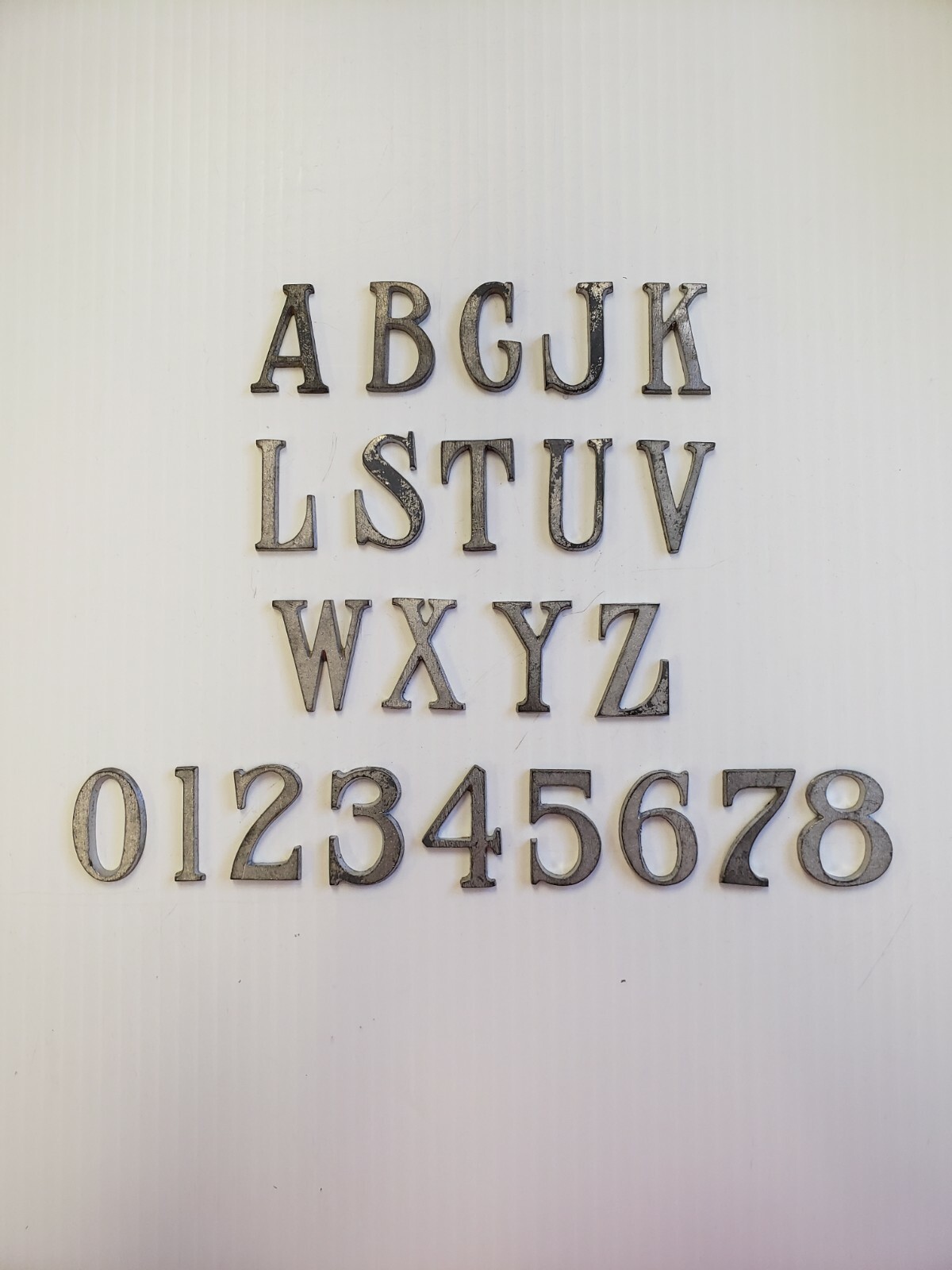 Metal Letters and Numbers 1 1/4 inch long Roman Font price per letter*