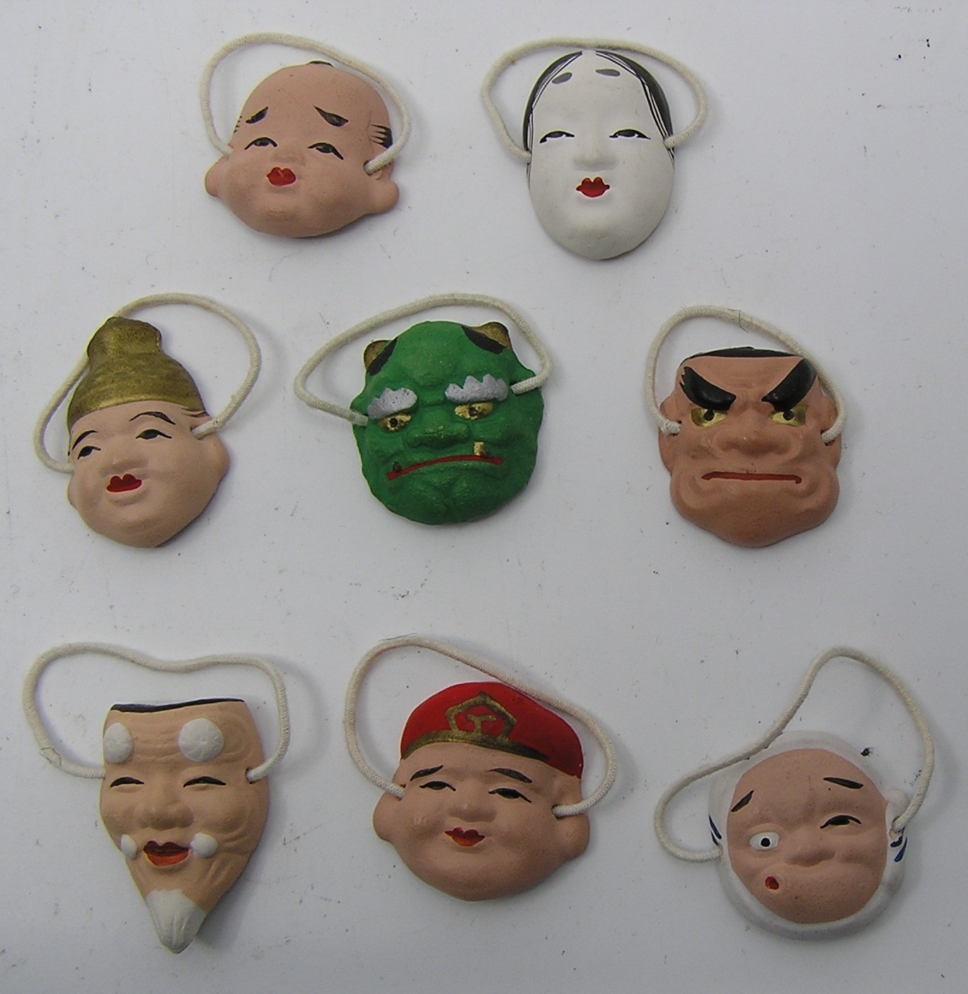 Lot of 8 Miniature Hand Painted Ceramic Masks ~ 1 1/8″ Tall ~ No Signature