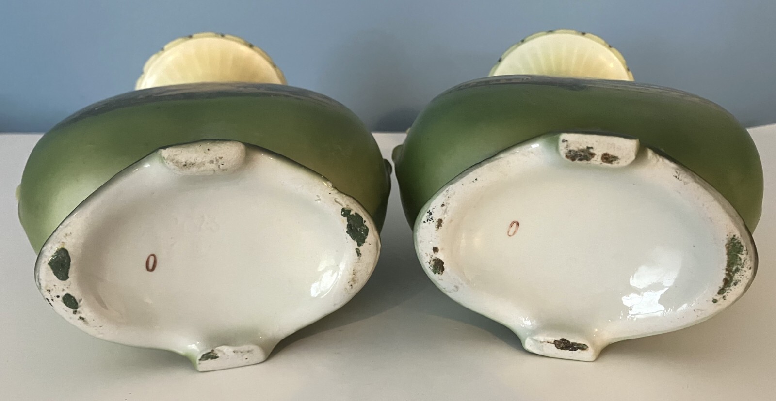 Pair of green landscape vases of unknown origin.