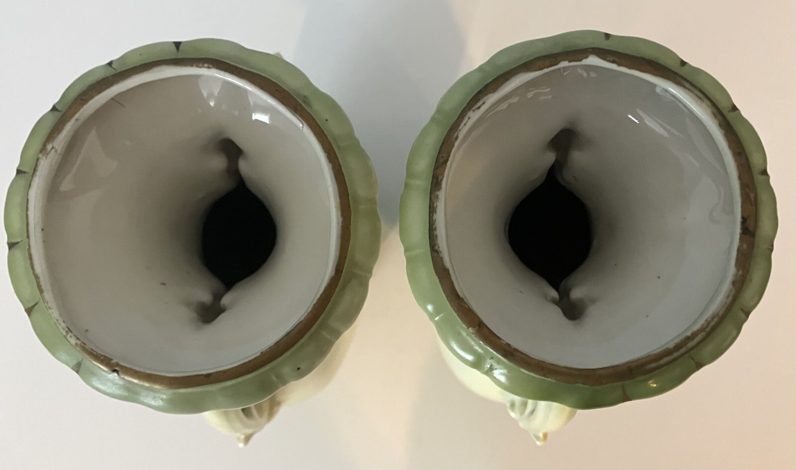 Pair of green landscape vases of unknown origin.