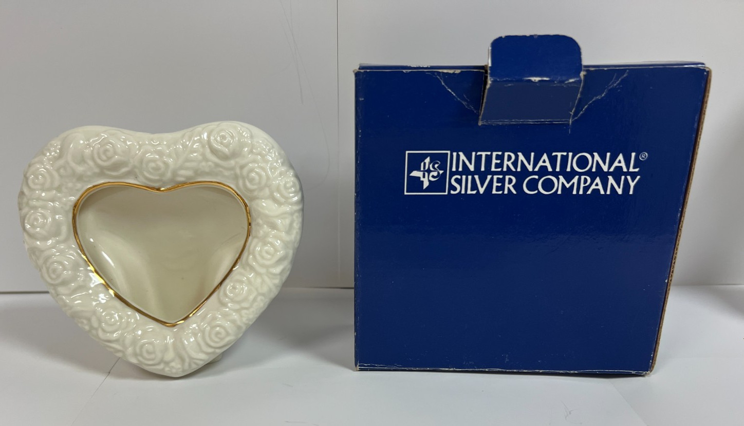 Ceramic Heart Frame – Holds 3″ W x 2-1/2″ H Photo by INTERNATIONAL SILVER