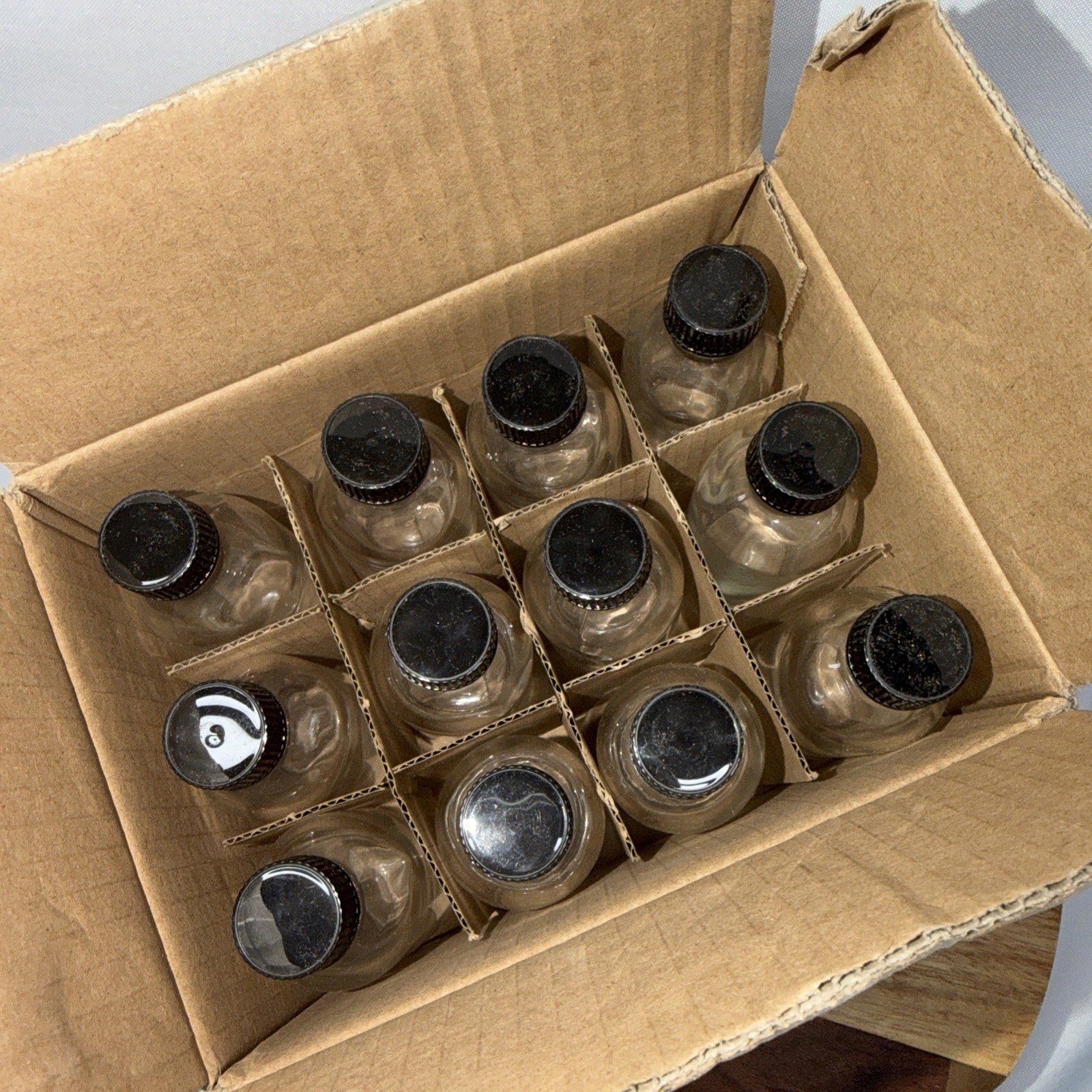 12-Pack Clear Glass Bottles with Black Caps 2oz NEW