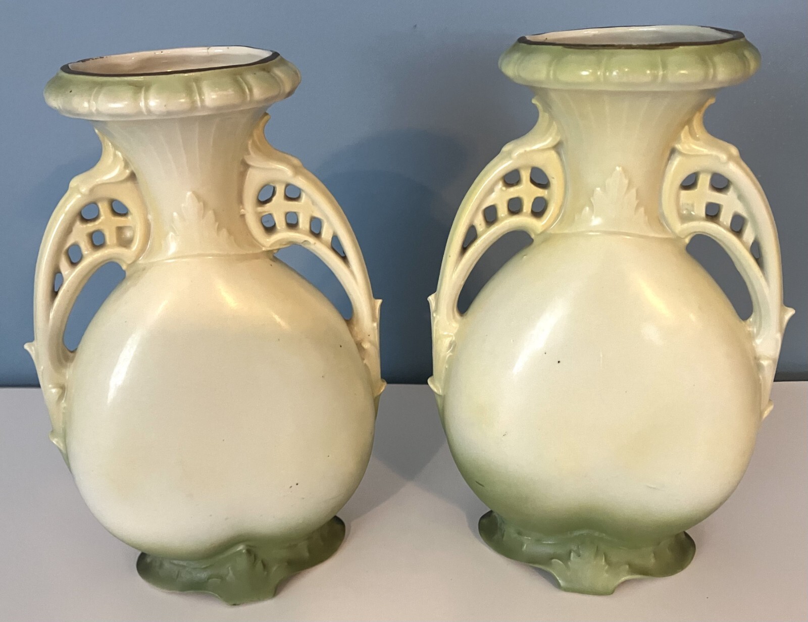 Pair of green landscape vases of unknown origin.